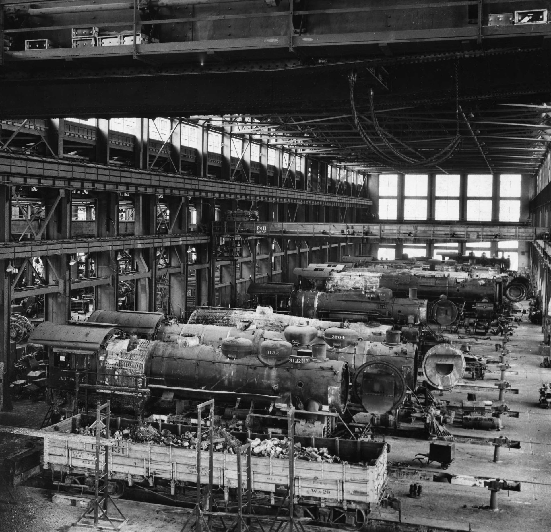Historic photograph of locomotives disassembled in the Albuquerque Rail Yards